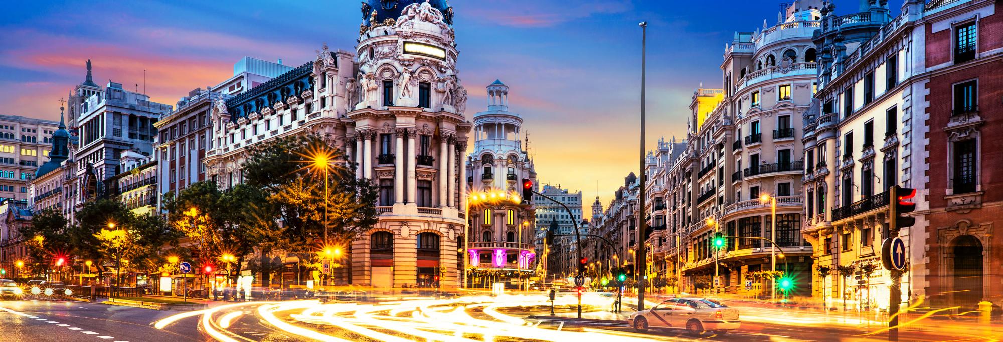 Large intersection in a Spanish city at dusk