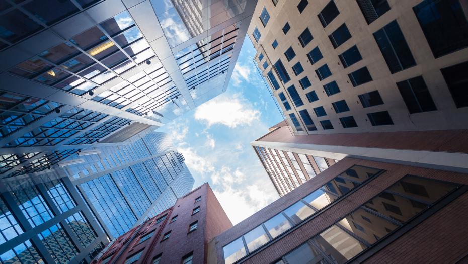 Ground view of buildings touching the sky