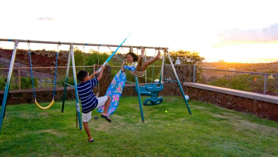 kids playing on swingset